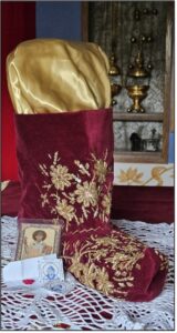 A slipper of Saint Spyridon at the Queen of All Skete, along with filaktas from Corfu containing snippets of his slippers.